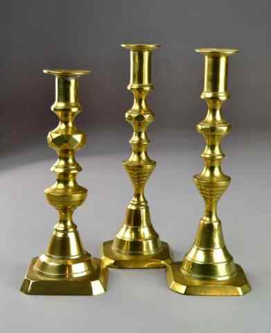 Appraisal: ENGLISH PUSHUP CANDLESTICKS TH CMatching pair of English brass turned