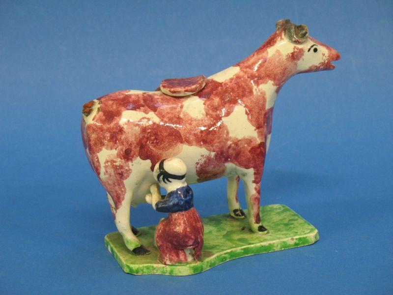 Appraisal: A LUSTRE POTTERY COW CREAMER late th early th century