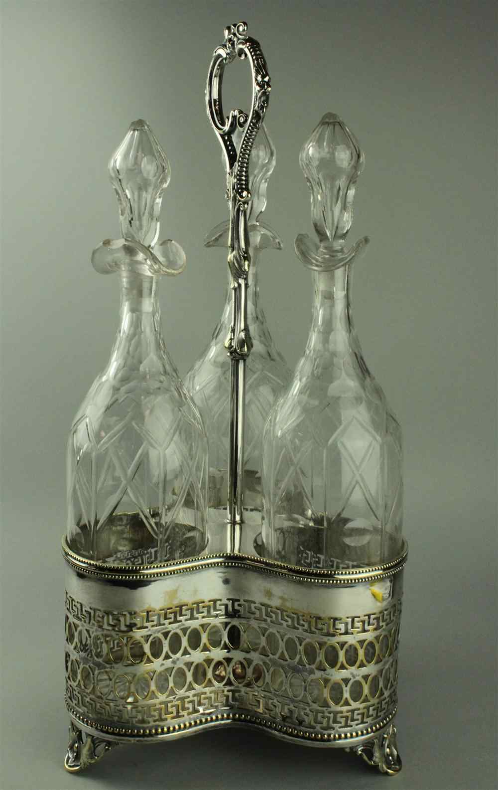 Appraisal: SHEFFIELD PLATE AND CUT GLASS LARGE CRUET SET the tripartite