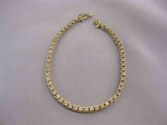 Appraisal: Diamond Tennis Bracelet round diamonds totaling carats in k yellow