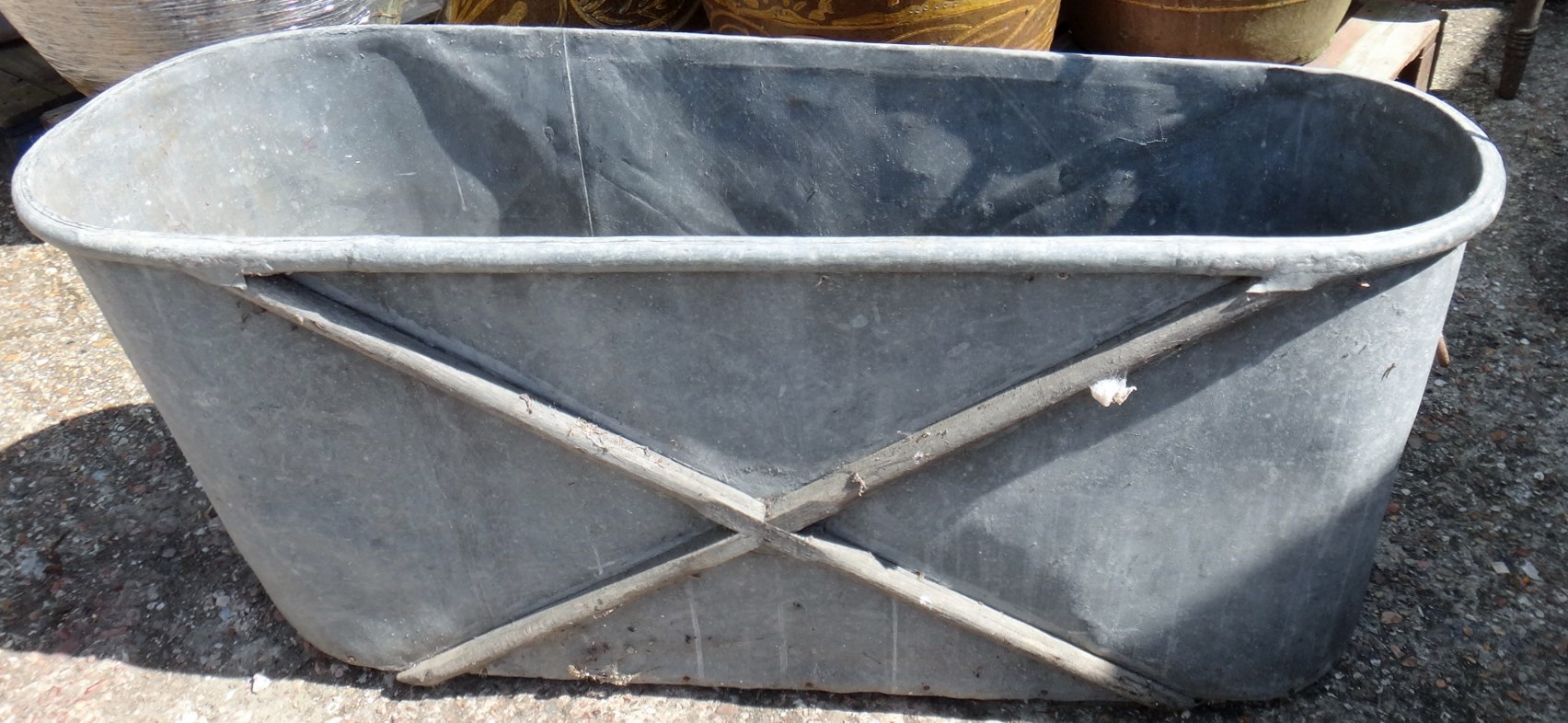 Appraisal: A galvanised bath of tapering rounded rectangular form cm wide