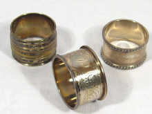 Appraisal: Two hallmarked silver napkin rings together with a silver plated