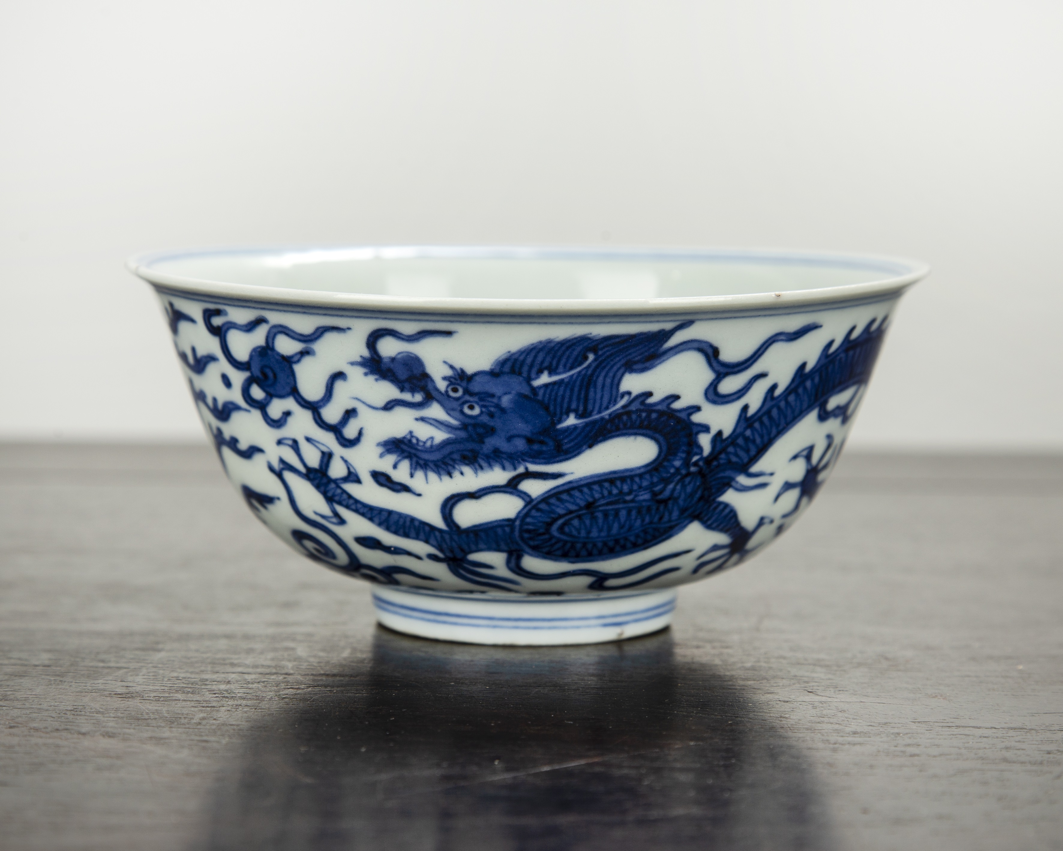 Appraisal: Blue and white porcelain bowl Chinese painted with a dragon