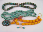 Appraisal: A mixed lot comprising two turquoise necklaces one amber necklace