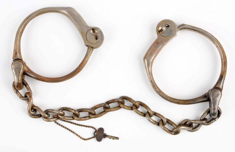 Appraisal: Bean Cobb Leg Irons Includes original key Slight surface rust