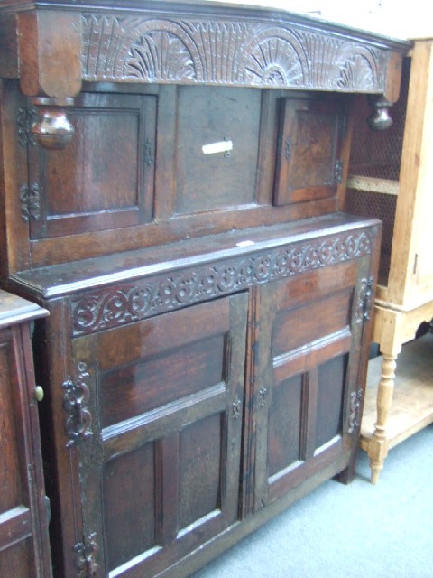 Appraisal: A th century and later court cupboard the carved arch