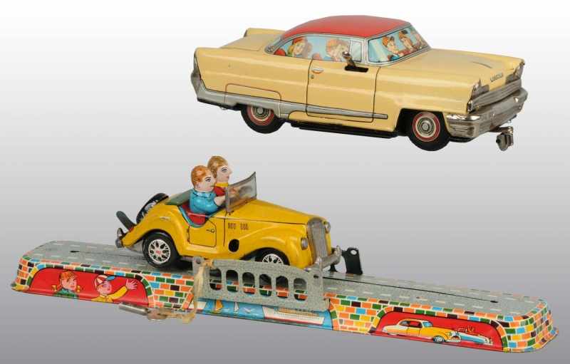 Appraisal: Lot of Tin Automobile Toys Description Japanese Working Includes one