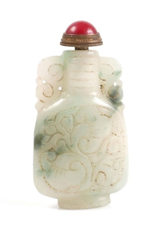 Appraisal: Chinese carved jade snuff bottle with floral motif Bottle measures