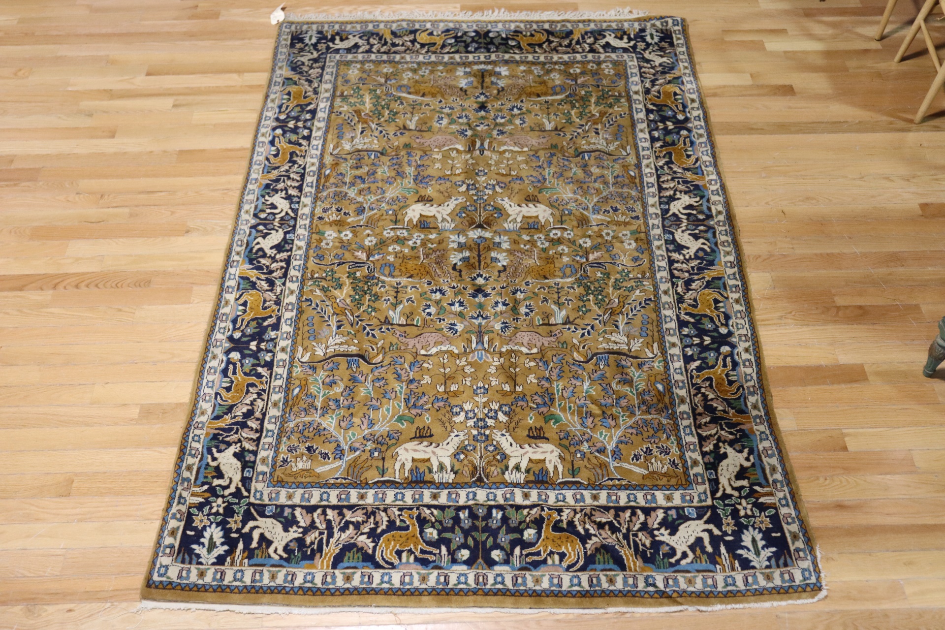 Appraisal: VINTAGE AND FINELY HAND WOVEN CARPET Great pattern with animals