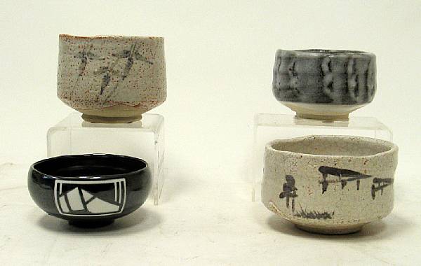 Appraisal: Four Japanese tea bowls One of e-Shino with landscape design