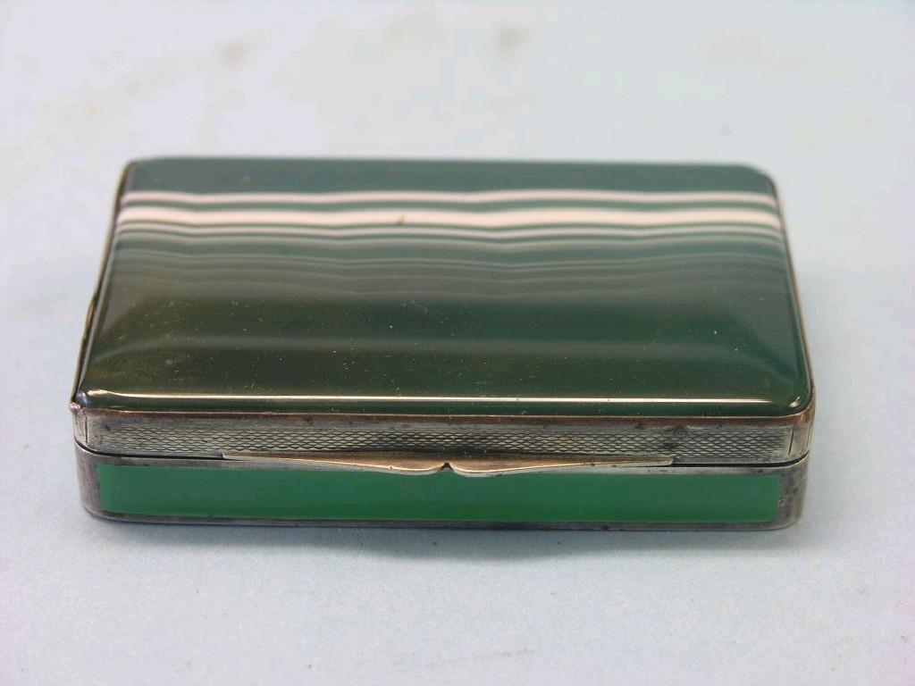 Appraisal: An engine-turned silver and green enamel box rectangular-shape with green