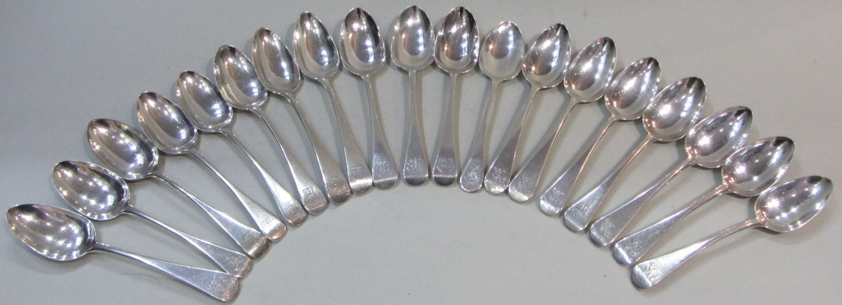 Appraisal: Eighteen silver Old English pattern dessert spoons seven London three