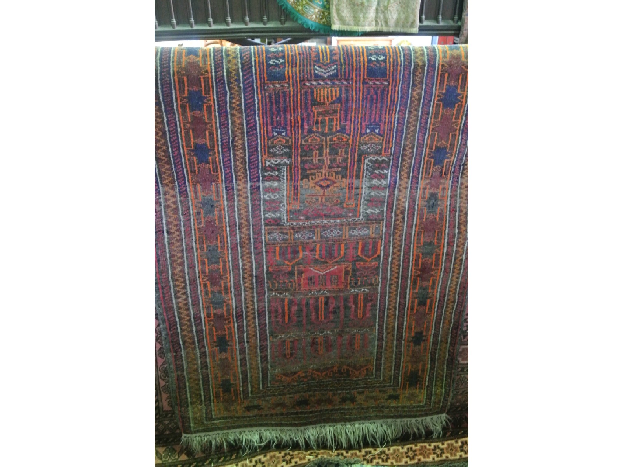 Appraisal: A woven wool work rug with central panel detailed with