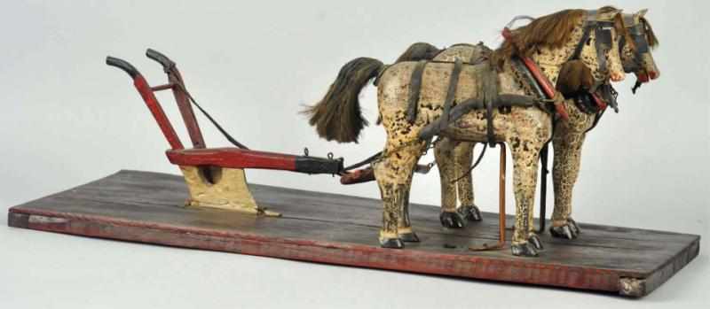 Appraisal: Wooden Folk Art Horses Pulling Plow Piece The horses have