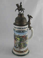 Appraisal: A German retirement bierstein the pewter lid with mounted cavalry