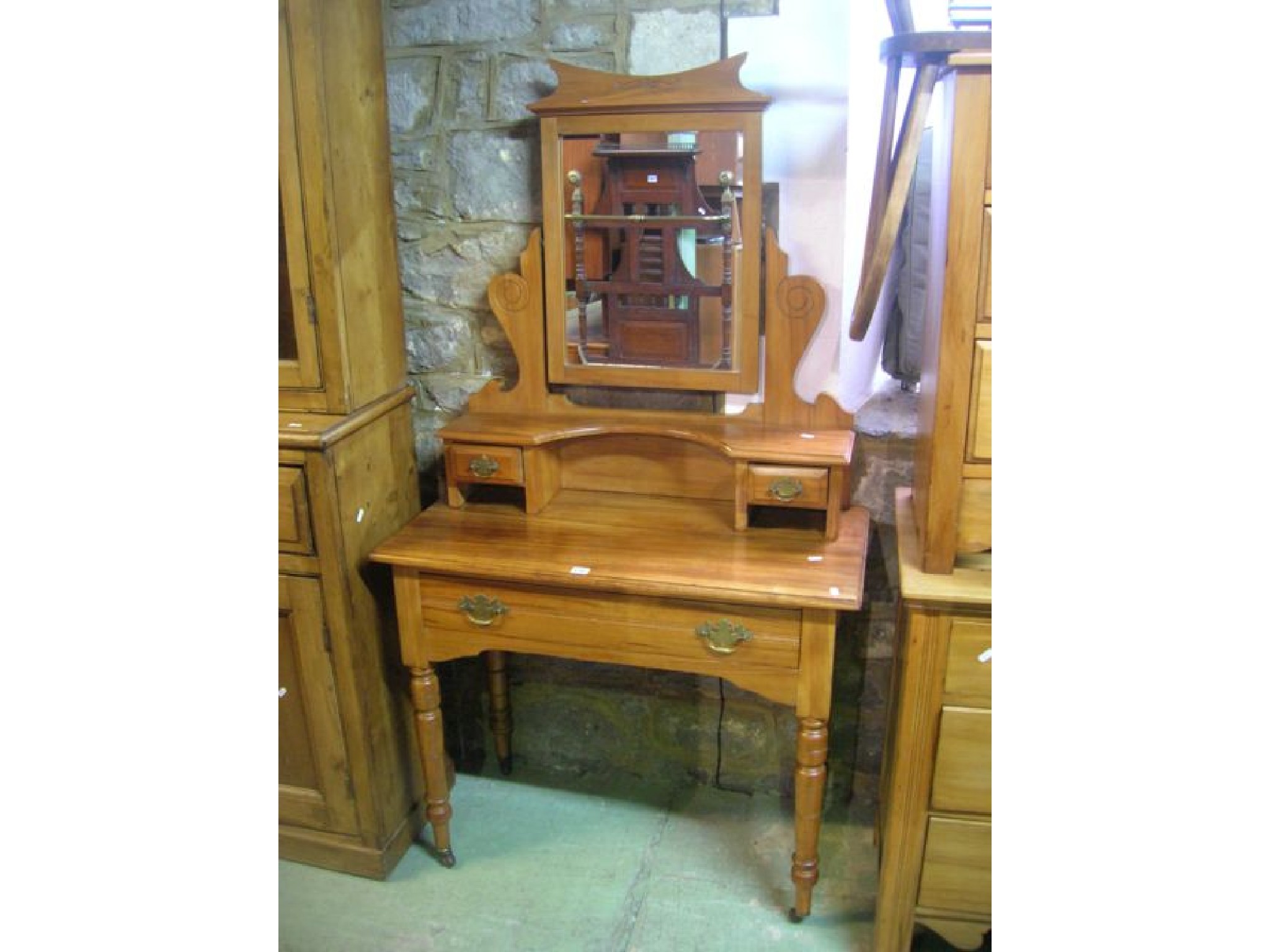 Appraisal: An Edwardian satin walnut bedroom chest of two long and