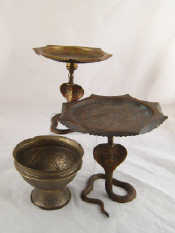 Appraisal: A pair of engraved and lacquered brass stands supported on