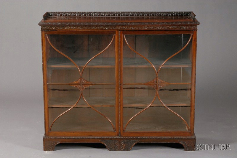 Appraisal: English Carved Mahogany Two-Door Bookcase th century with three-quarter gallery