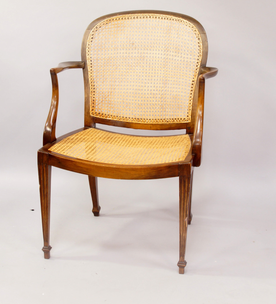 Appraisal: A 's bergere chair with crook arms and cane seat