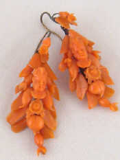 Appraisal: A pair of antique carved coral earrings with central carved