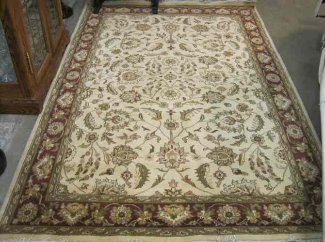 Appraisal: HAND KNOTTED ORIENTAL CARPET Persian Kashan design of floral tracery