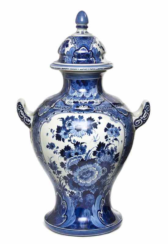 Appraisal: A Delft Ceramic Covered Vase of baluster handled form with