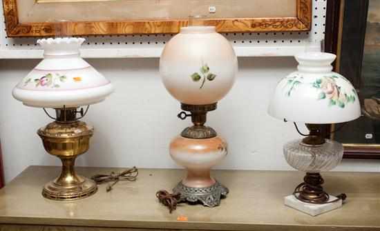 Appraisal: Three Victorian style milk glass and brass oil lamps Estimate