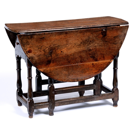 Appraisal: An oak gateleg table th early th c on baluster