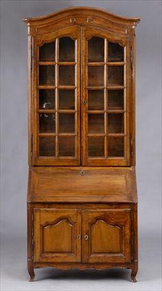 Appraisal: LOUIS XV PROVINCIAL WALNUT SECRETAIRE BOOKCASE The molded cresting above