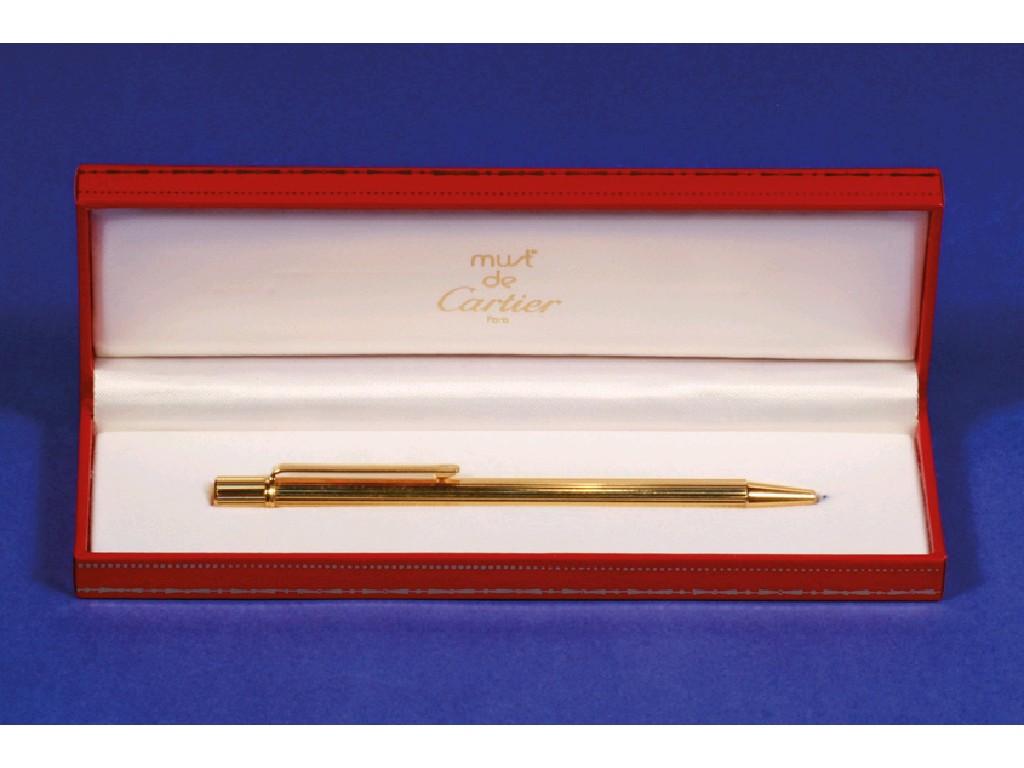 Appraisal: A CARTIER GOLD PLATED BALL-POINT PEN with reeded body long