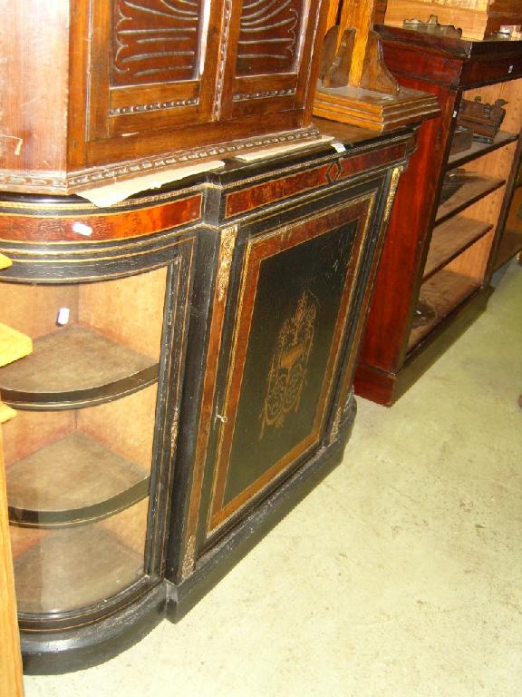 Appraisal: A Victorian ebonised credenza fitted with central door flanked by