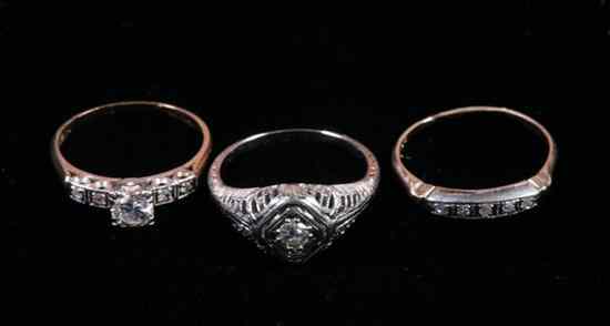 Appraisal: THREE EARLY-TO-MID- TH CENTURY K GOLD AND DIAMOND RINGS One