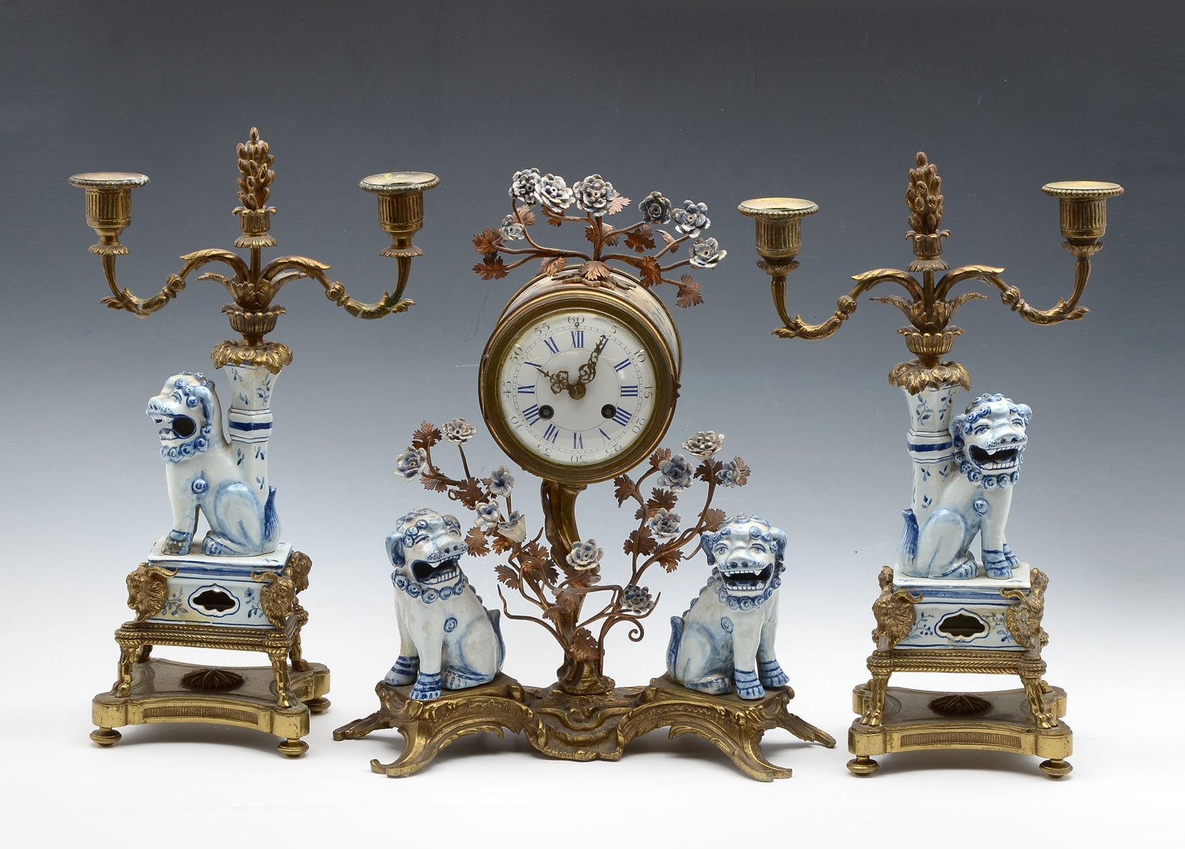 Appraisal: FRENCH PORCELAIN CLOCK GARNITURE SET piece French Chinoiserie set having