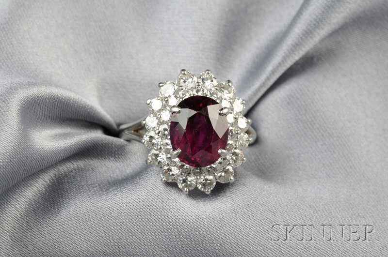 Appraisal: Platinum Ruby and Diamond Ring Cartier set with an oval-cut