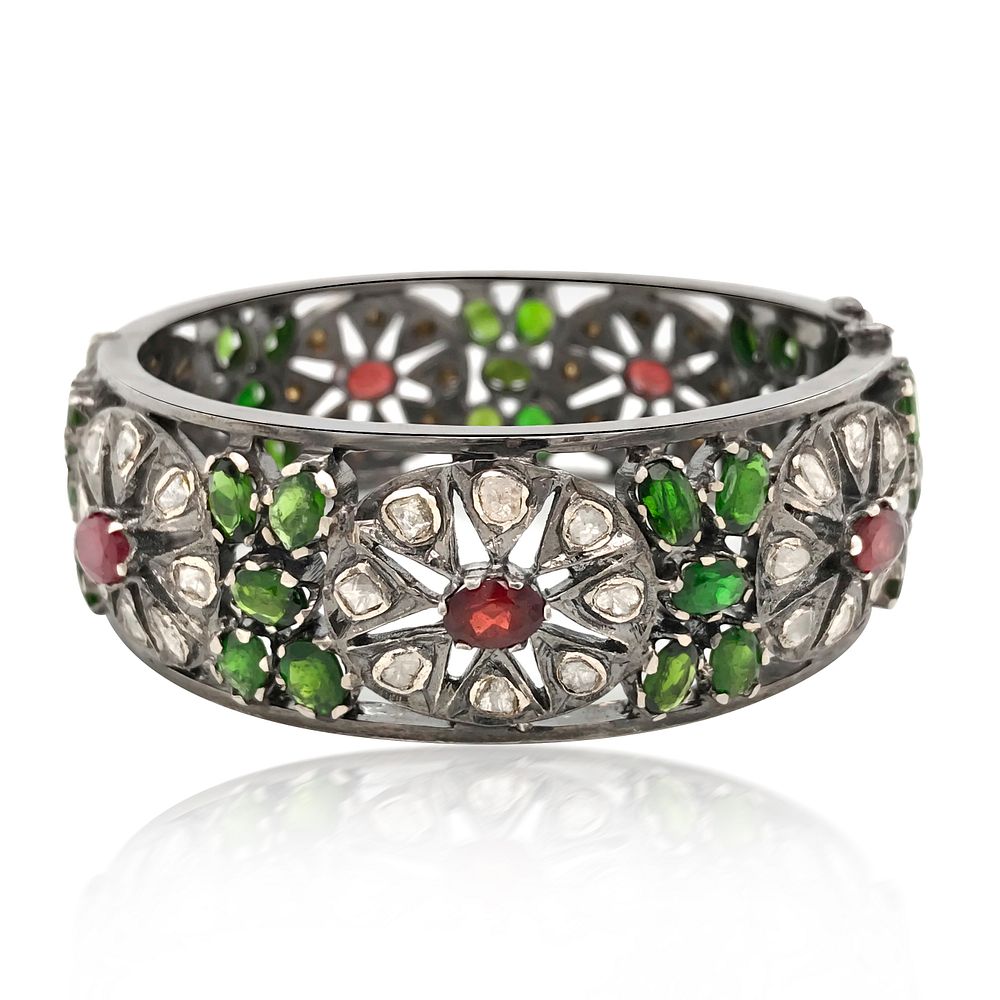 Appraisal: TSAVORITE RUBY AND DIAMOND BANGLE TSAVORITE RUBY AND DIAMOND BANGLE