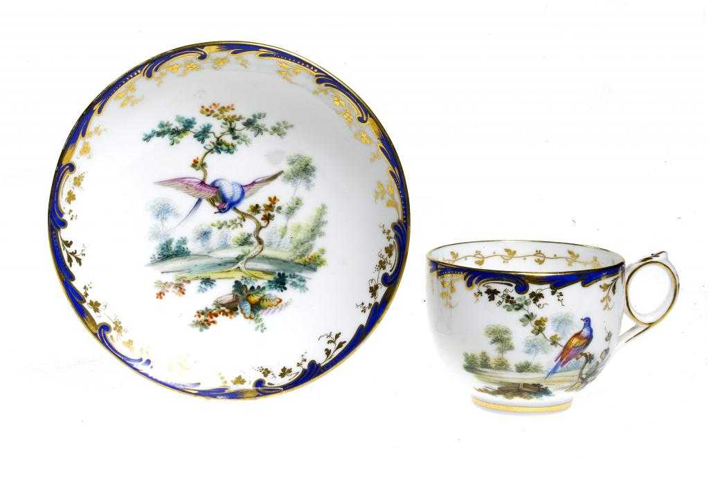 Appraisal: A COALPORT TEACUP AND SAUCER painted in the manner of