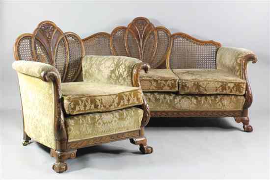 Appraisal: A 's carved walnut three piece bergere suite with shield