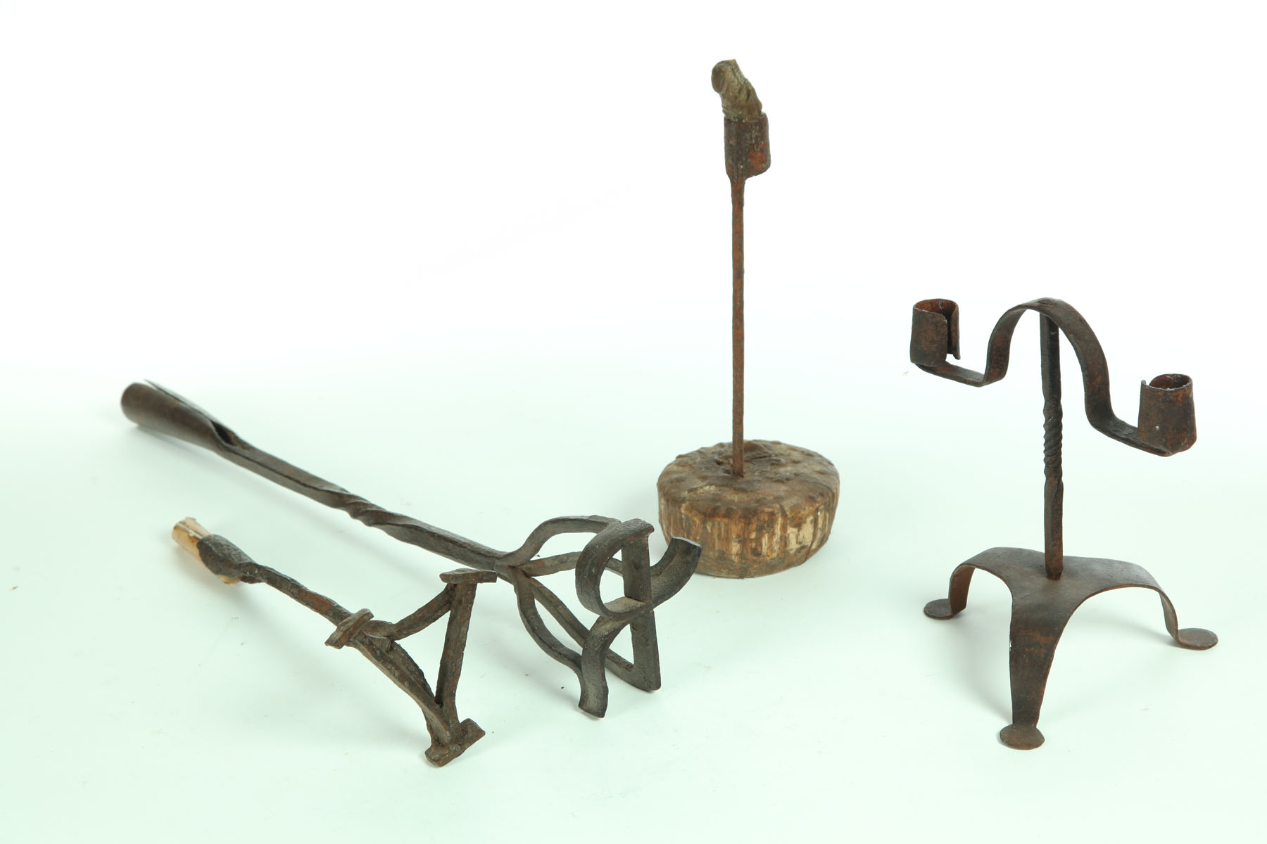 Appraisal: THREE WROUGHT IRON LIGHTING DEVICES AND BRANDING IRON American th