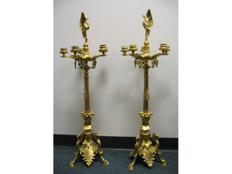 Appraisal: PAIR OF NEOCLASSICAL STYLE GILT METAL CANDELABRA Centering a stork