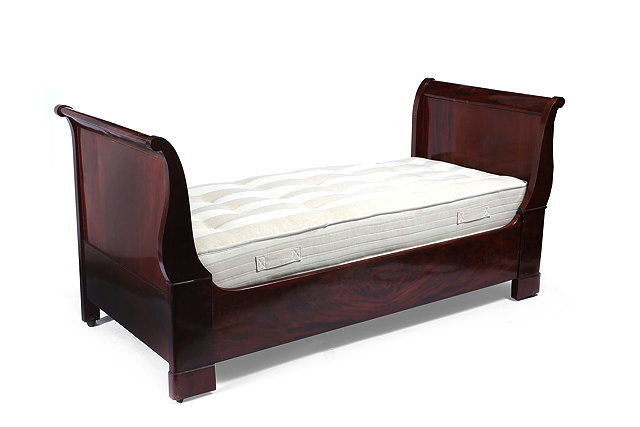 Appraisal: A MAHOGANY DAY BED with scroll ends approximately cm long