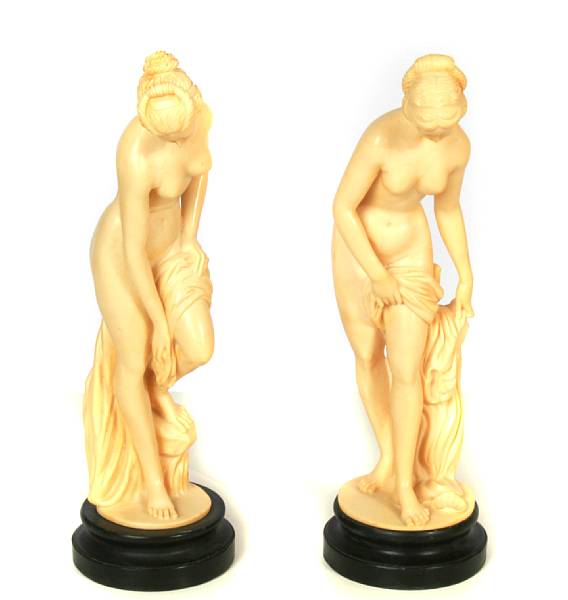 Appraisal: A pair of resin figures of venus together with a