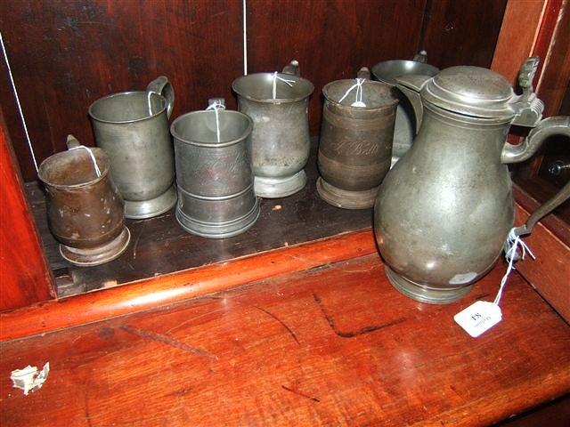 Appraisal: An antique Continental pewter baluster lidded jug with scallop shell