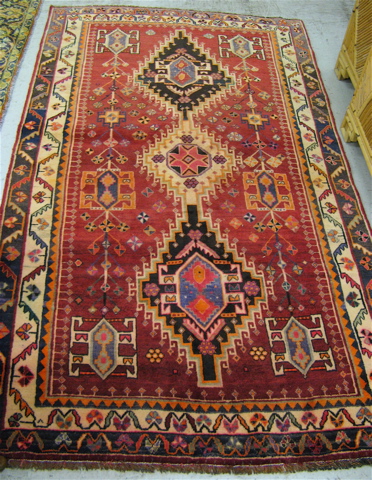 Appraisal: PERSIAN TRIBAL AREA RUG three geometric medallion and surrounding stylized