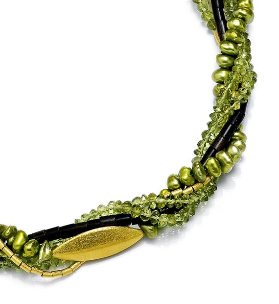 Appraisal: A PERIDOT PEARL AND EBONY NECKLACE Gilded silver clasp and