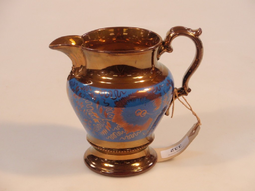 Appraisal: A mid thC copper lustre jug of baluster form with