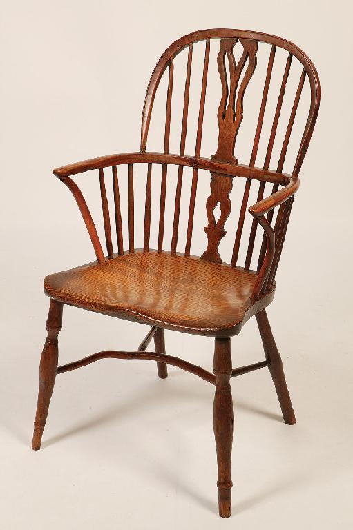 Appraisal: A BEECH AND ELM HIGH BACKED WINDSOR ARMCHAIR with a