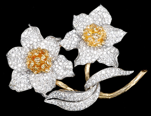 Appraisal: Diamond flower brooch in pt and k yg ca Two