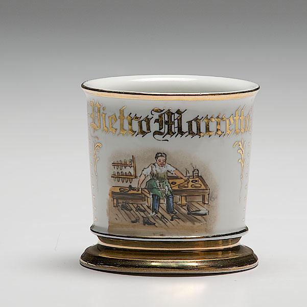 Appraisal: COBBLER'S OCCUPATIONAL SHAVING MUG porcelain with polychrome painted scene of