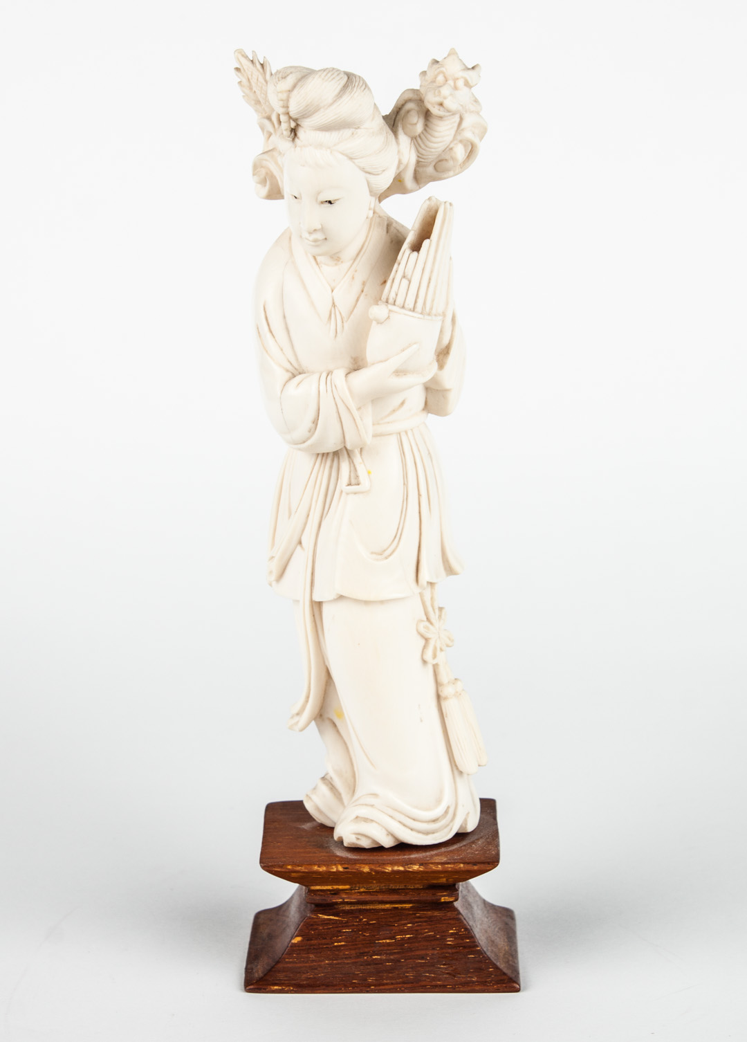 Appraisal: Japanese carved ivory deity modeled as female figure with small