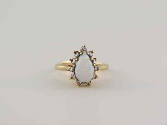 Appraisal: Opal Diamond Ring fiery carat pear shape gem surrounded by